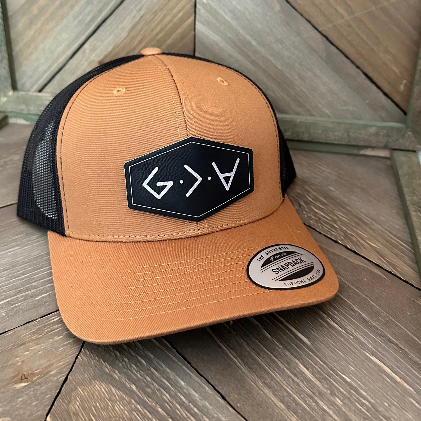 Yupoong Trucker Hat with Custom Designed Leatherette Patch